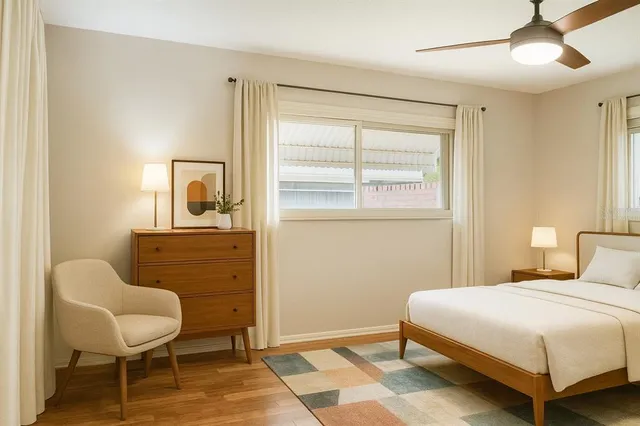 a bedroom with a bed and a chair