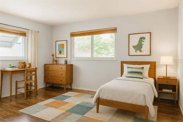 a bedroom with a bed and a table