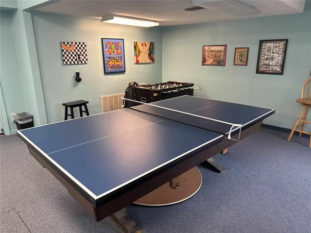 a kitchen with a sink a stove and cabinets