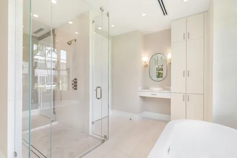 a bathroom with a granite countertop sink a toilet and with bathtub