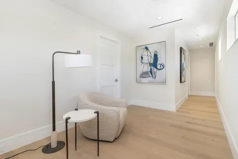 a bedroom with a bed and a potted plant