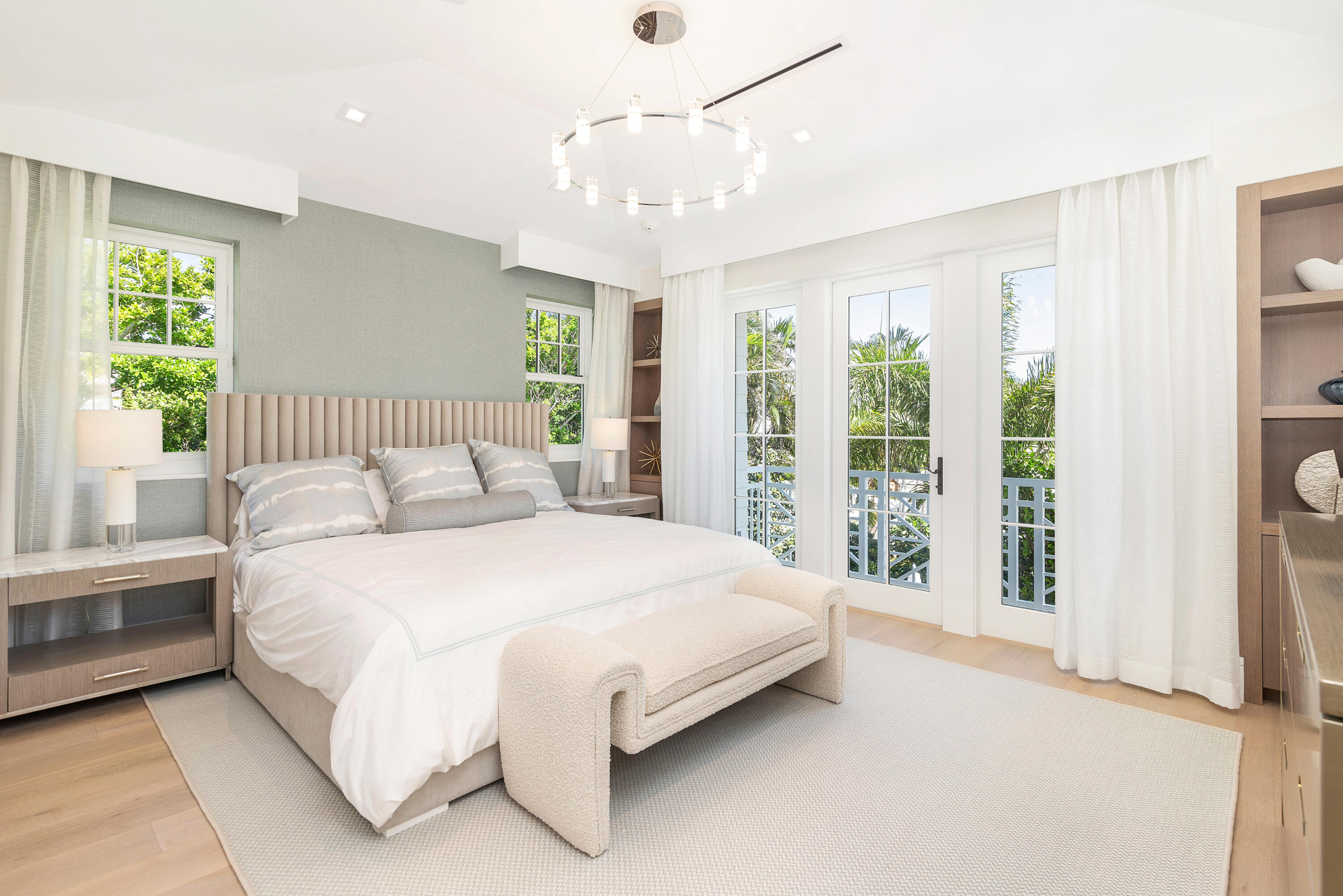 223 Monterey Road Palm Beach, FL 33480 - Photo 33 of 45 a bedroom with a large bed and a chandelier