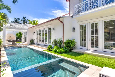 a view of a patio with a table and chairs