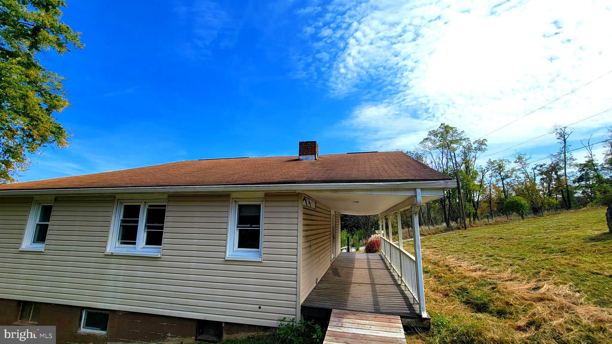 12809 Walsh Road Mount Savage, MD 21545 - Photo 13 of 30 a front view of house with yard