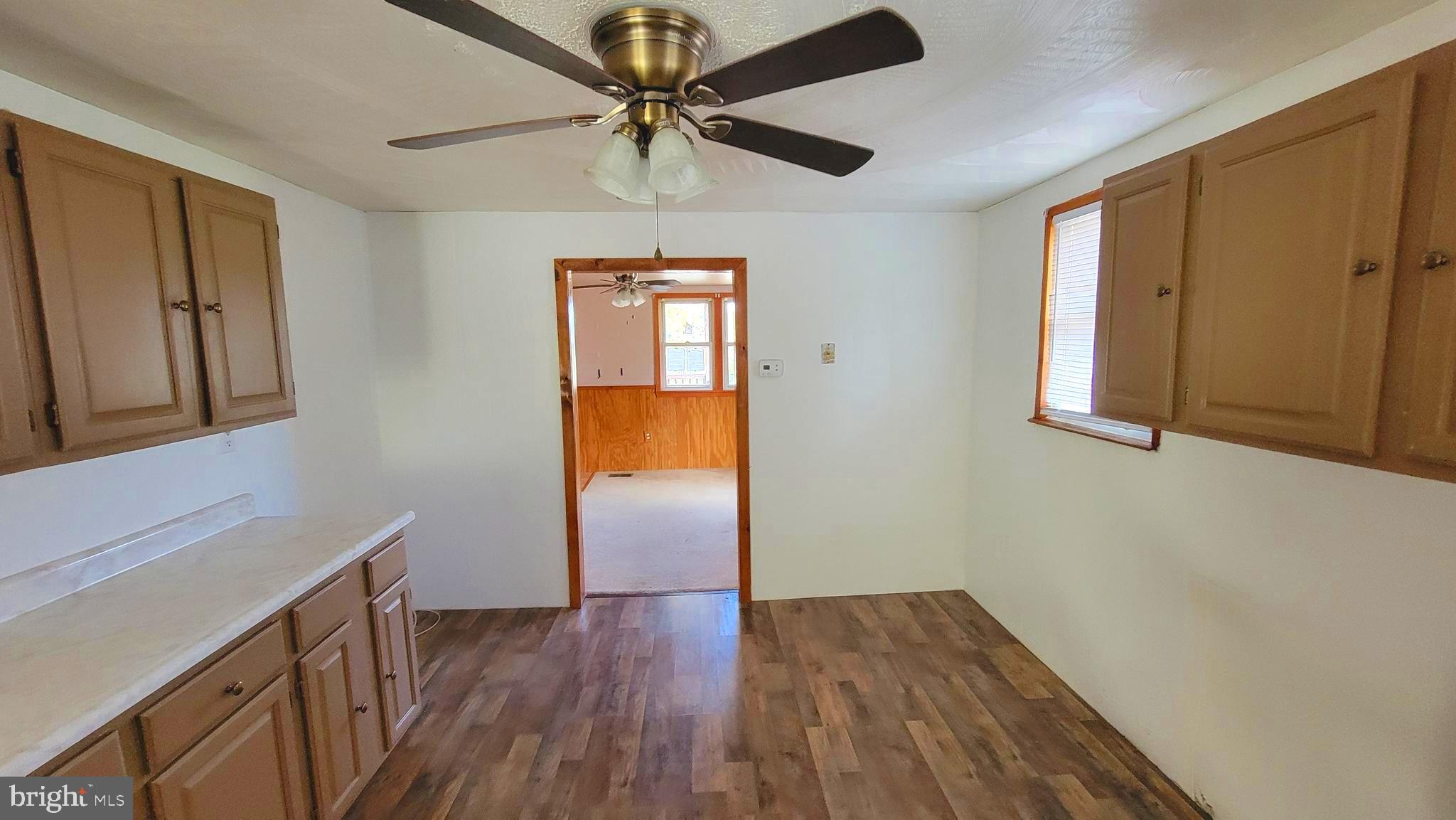 12809 Walsh Road Mount Savage, MD 21545 - Photo 17 of 30 a view of empty room with wooden floor and fan