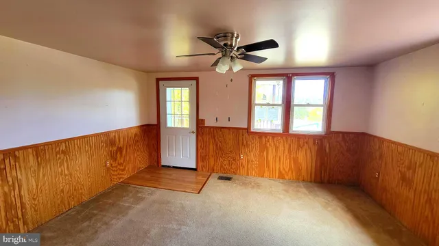 a view of livingroom with hardwood floor and hallway