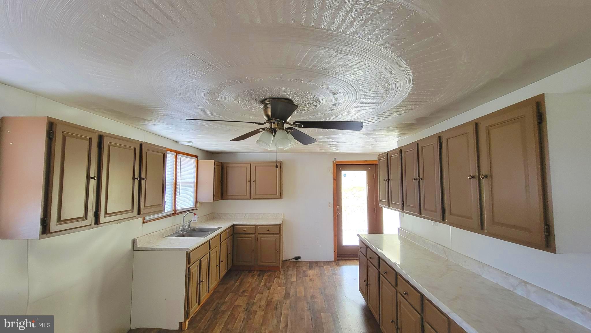 12809 Walsh Road Mount Savage, MD 21545 - Photo 22 of 30 a kitchen with granite countertop a stove and a sink