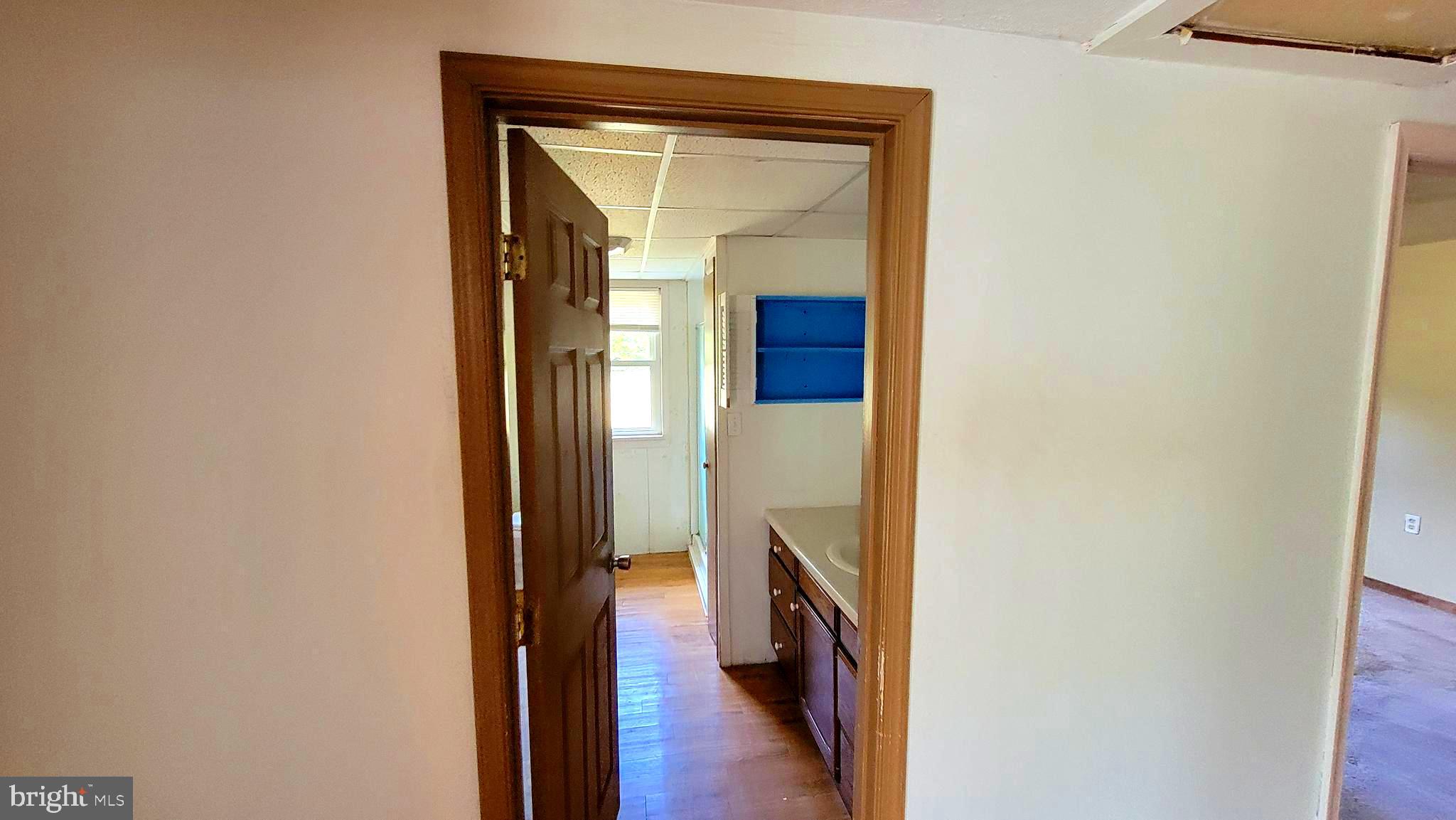 12809 Walsh Road Mount Savage, MD 21545 - Photo 23 of 30 a view of a hallway with wooden floor