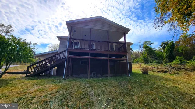 a view of a wooden house with a yard