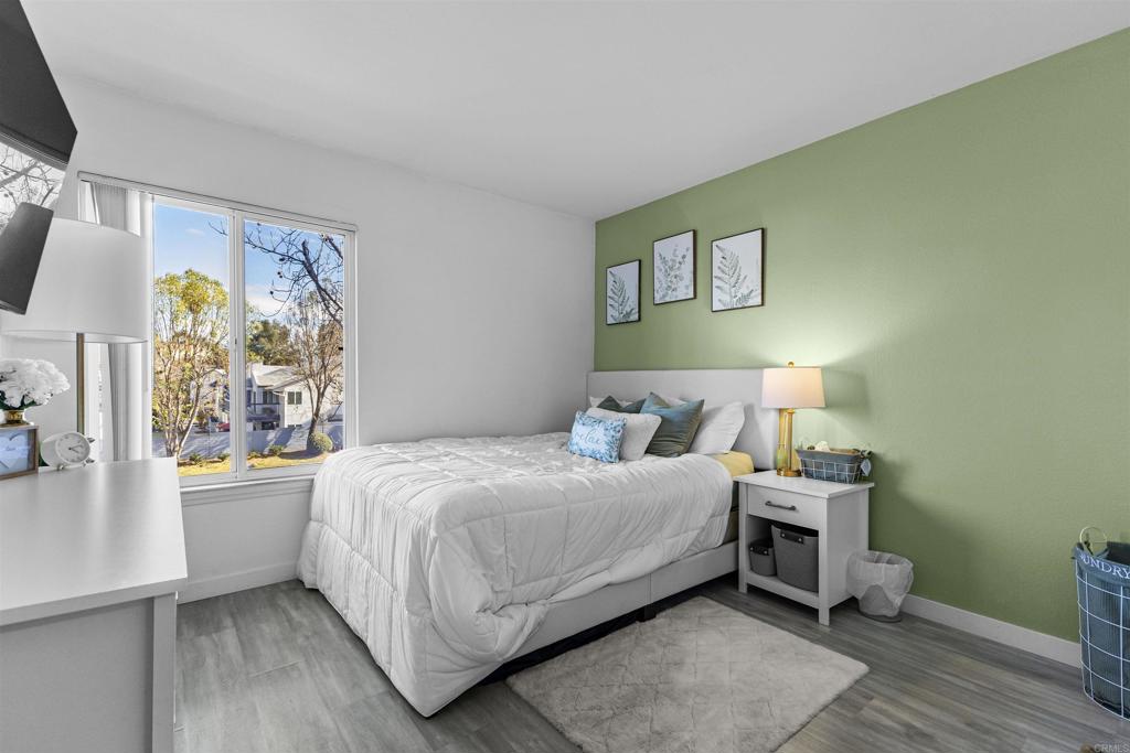 495 San Pasqual Valley Road, Unit 144 Escondido, CA 92025 - Photo 11 of 20 a bedroom with a bed and a window