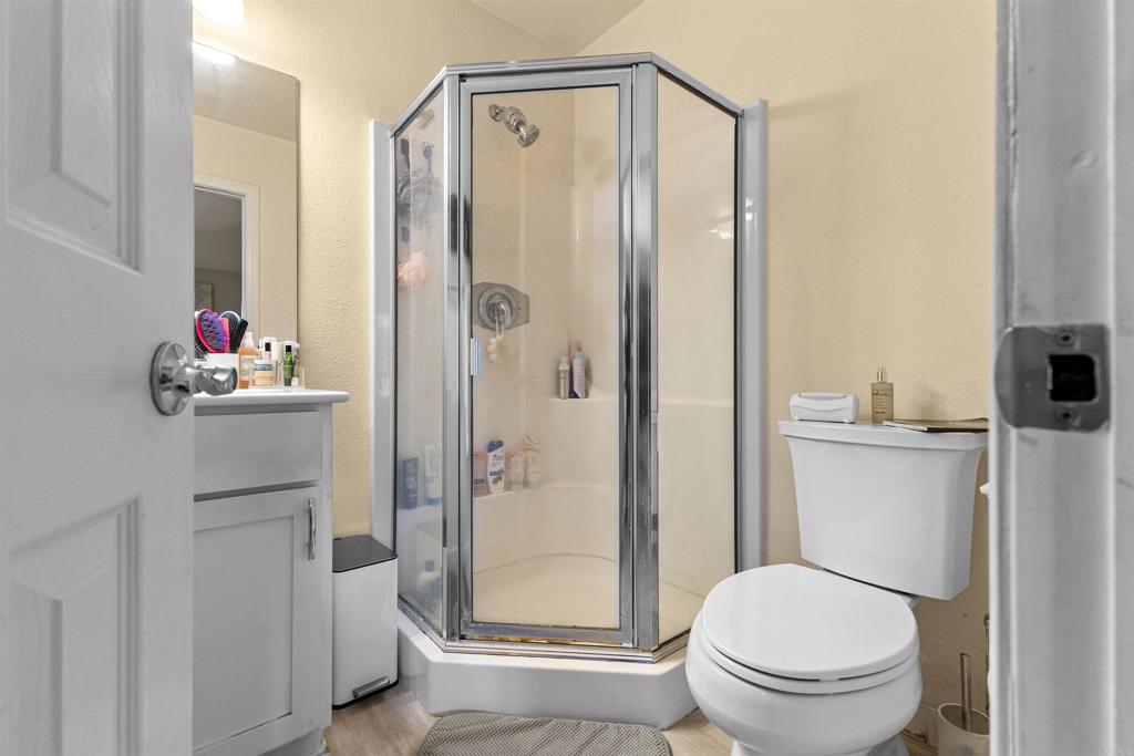 495 San Pasqual Valley Road, Unit 144 Escondido, CA 92025 - Photo 8 of 20 a bathroom with a shower a toilet and a sink