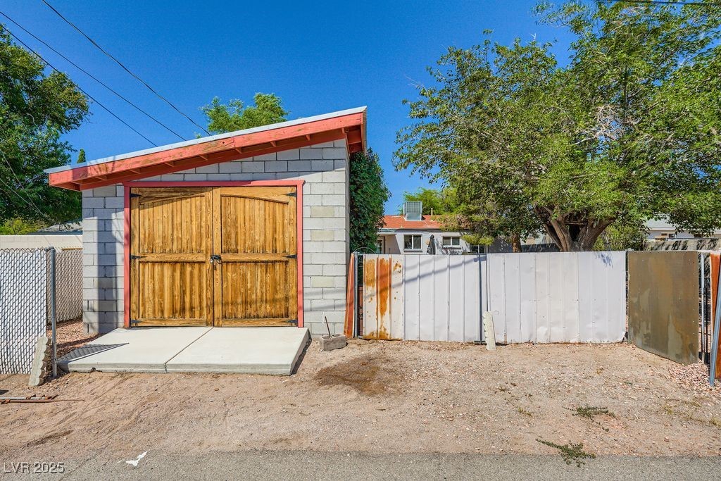 573 7th Street Boulder City, NV 89005 - Photo 25 of 25 View of back of garage from alley. Gate opens for RV Parking in rear yard
