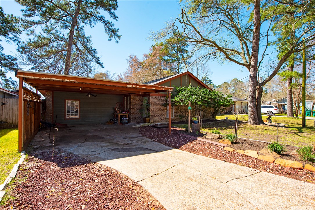 1402 South 5th Street Conroe, TX 77301 - Photo 14 of 14 a view of a house with backyard and sitting area