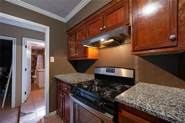 a kitchen with a stove and a microwave