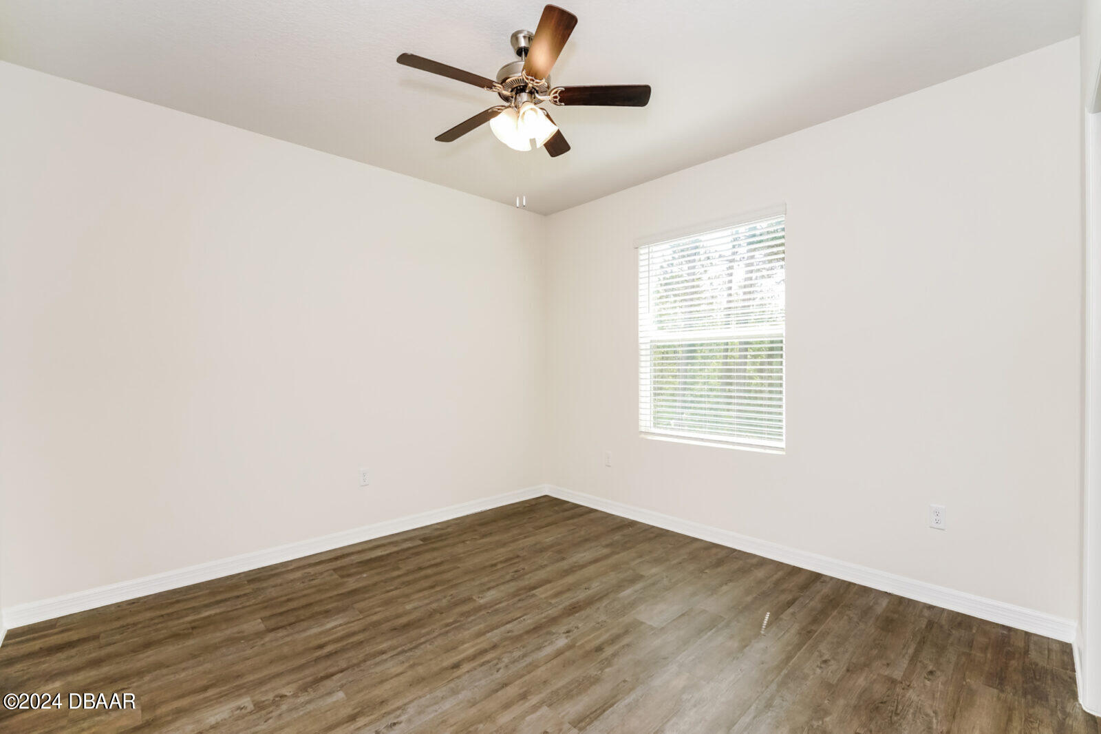 44 Center Grande Road Ormond Beach, FL 32174 - Photo 4 of 20 a view of a big room with wooden floor and windows in a room