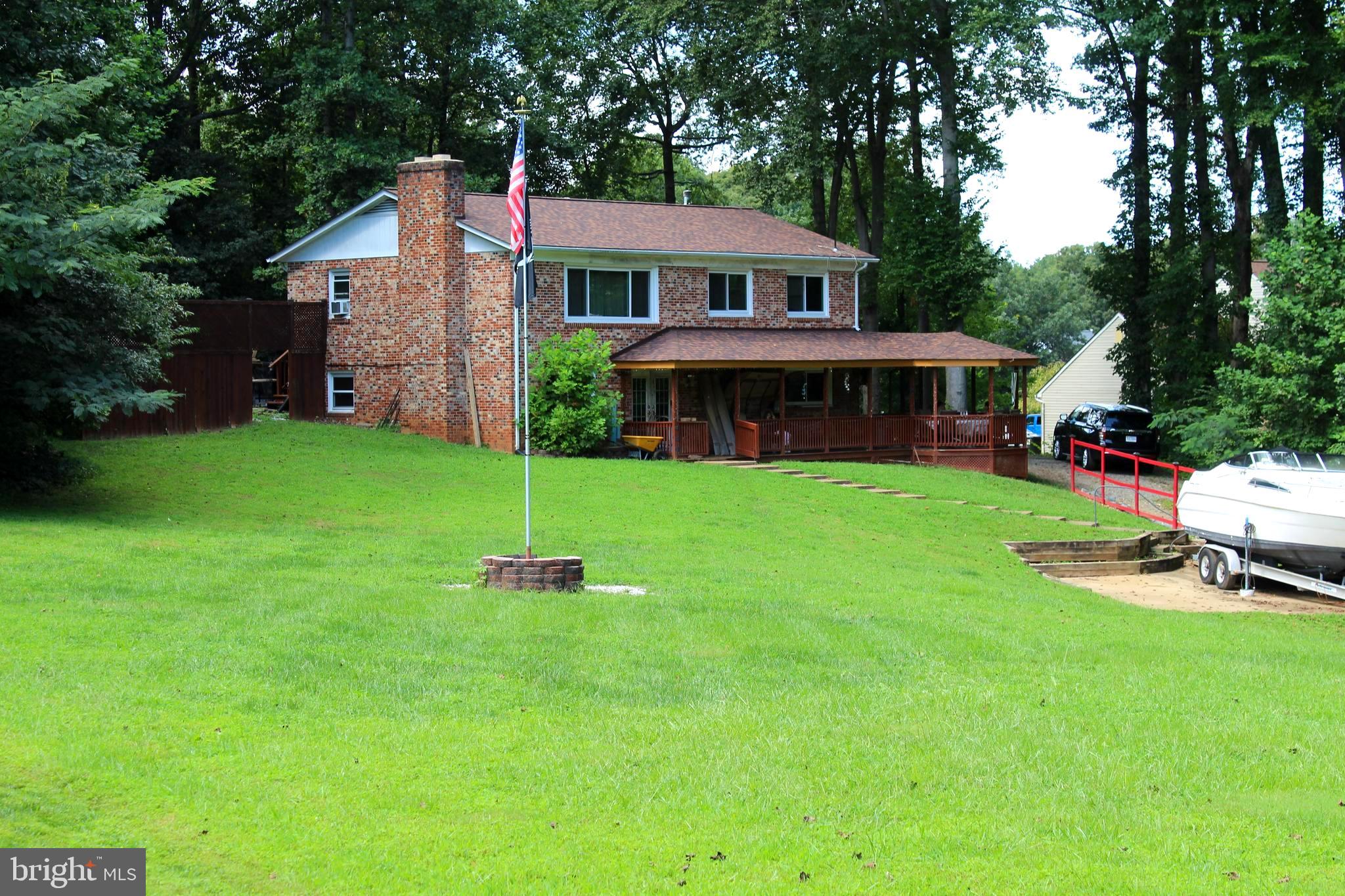 a front view of a house with a yard table and chairs