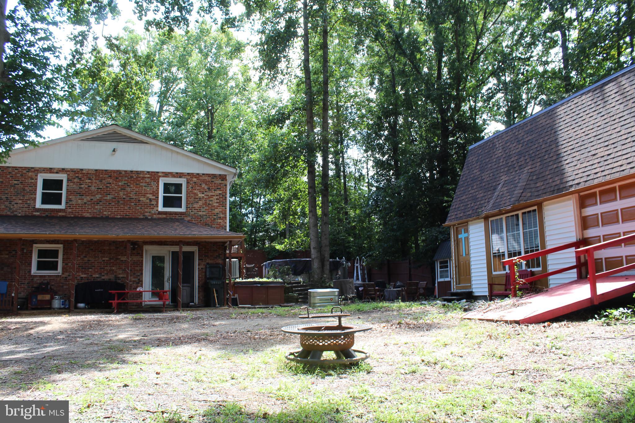 15090 Jonah Cove Place Woodbridge, VA 22193 - Photo 13 of 42 a front view of a house with a yard