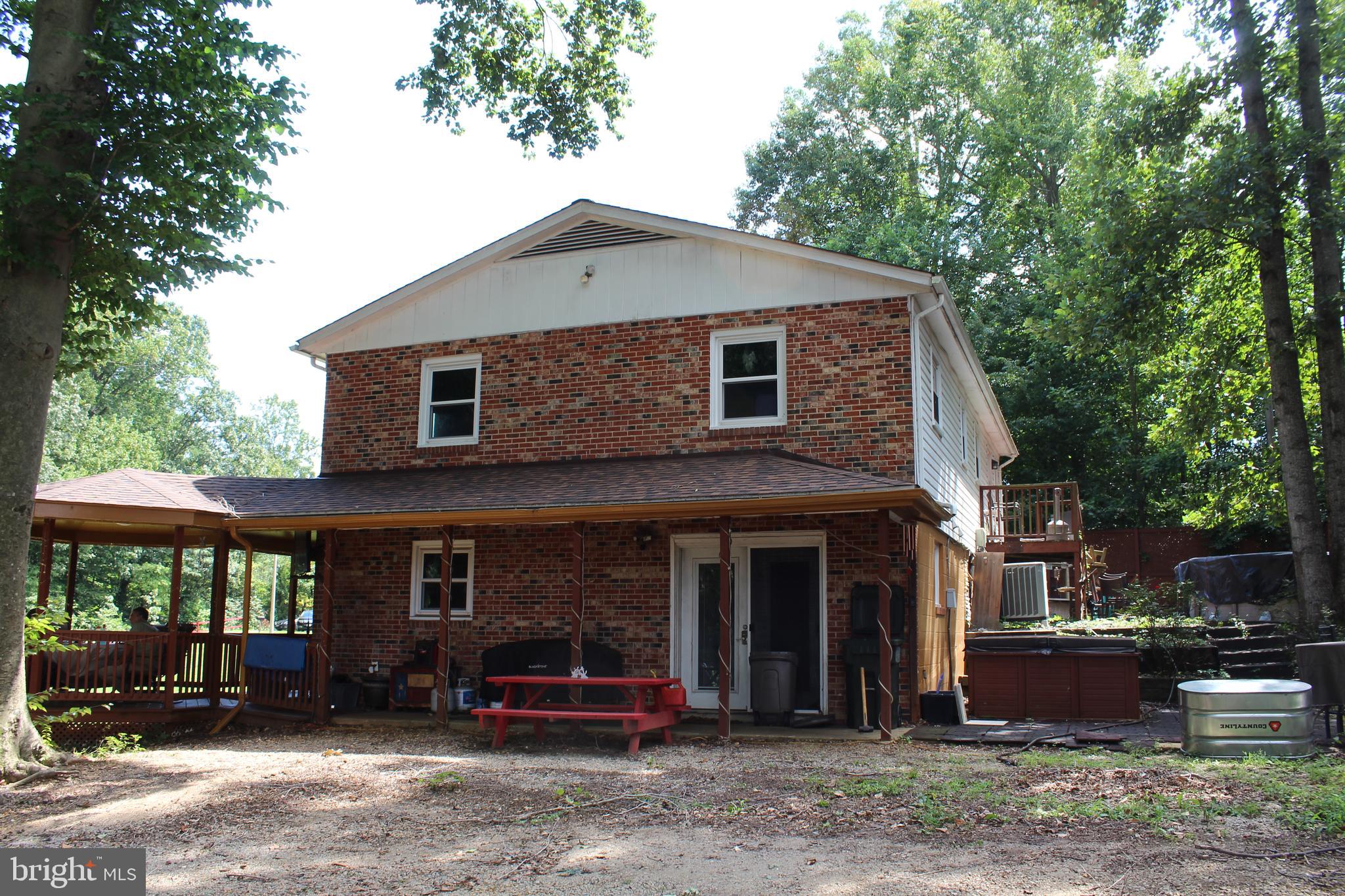 15090 Jonah Cove Place Woodbridge, VA 22193 - Photo 15 of 42 a front view of a house with a yard