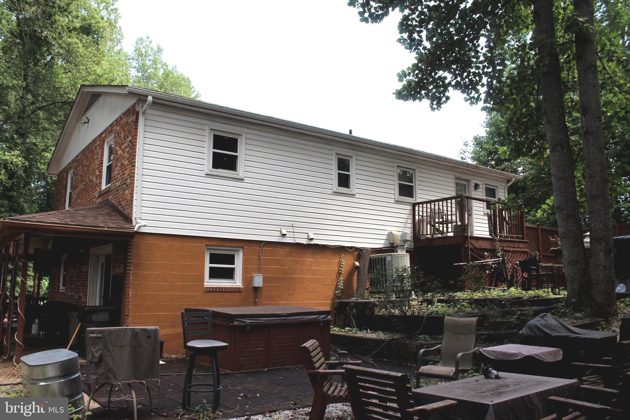 15090 Jonah Cove Place Woodbridge, VA 22193 - Photo 16 of 42 a view of backyard of house with outdoor seating