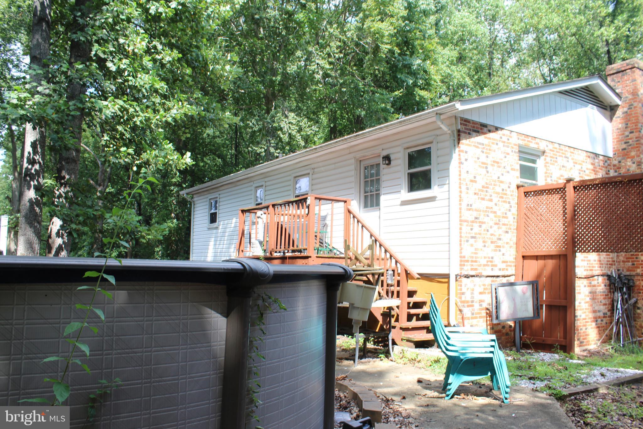 15090 Jonah Cove Place Woodbridge, VA 22193 - Photo 19 of 42 a view of a house with a patio