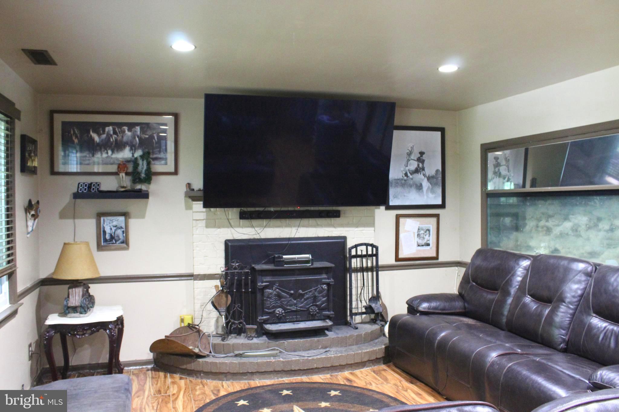 15090 Jonah Cove Place Woodbridge, VA 22193 - Photo 23 of 42 a living room with furniture and a flat screen tv