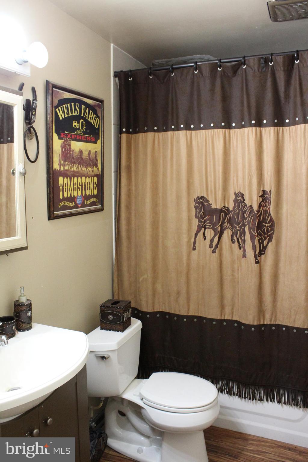 15090 Jonah Cove Place Woodbridge, VA 22193 - Photo 25 of 42 a bathroom with a toilet and a shower