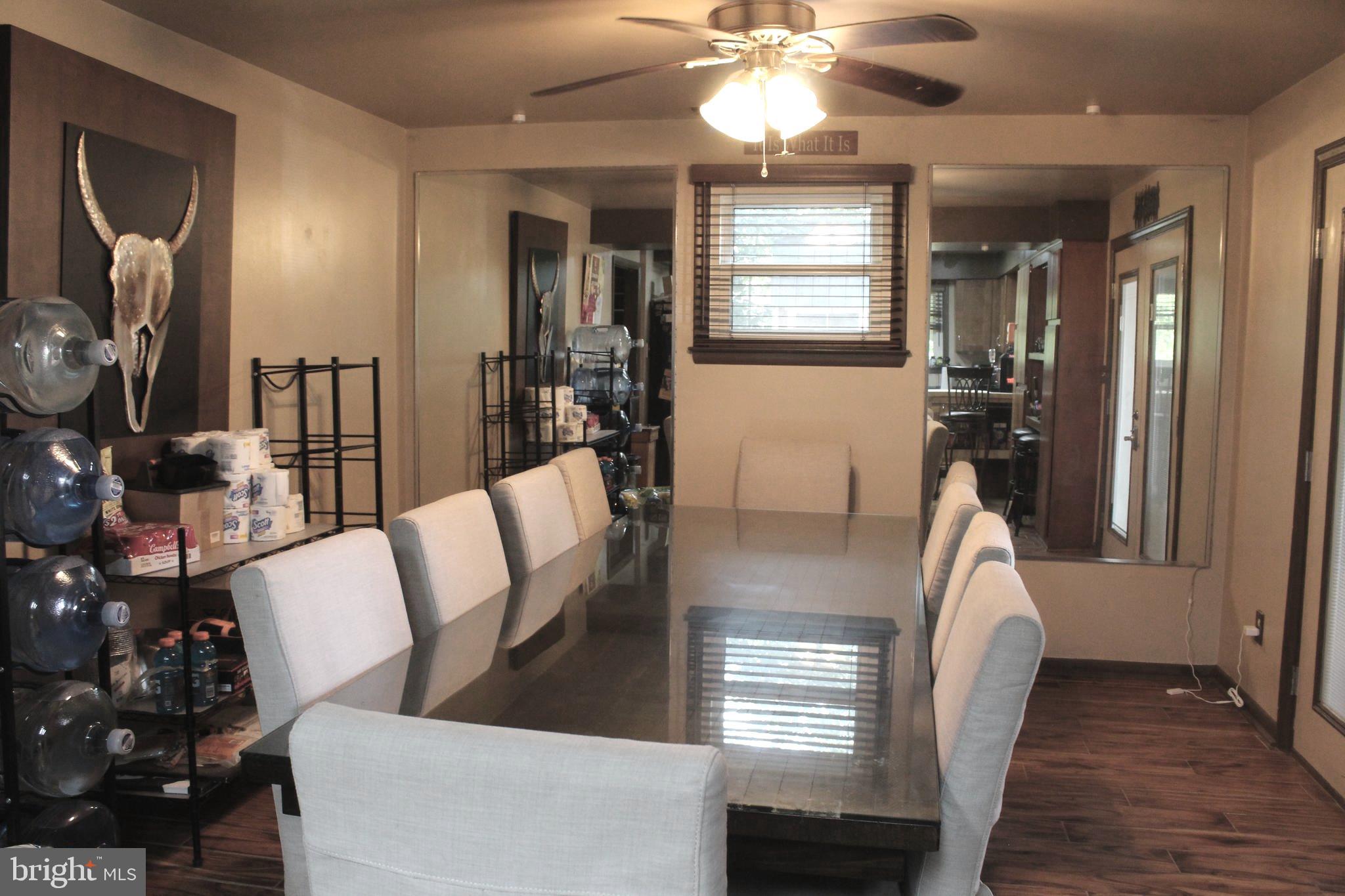 15090 Jonah Cove Place Woodbridge, VA 22193 - Photo 26 of 42 a view of a livingroom with furniture window and wooden floor