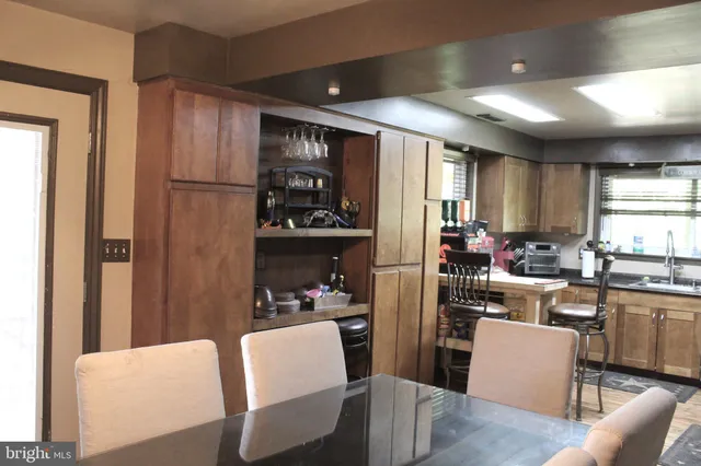 a kitchen with a sink cabinets and window