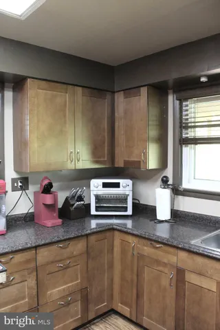 a kitchen with a refrigerator and a sink