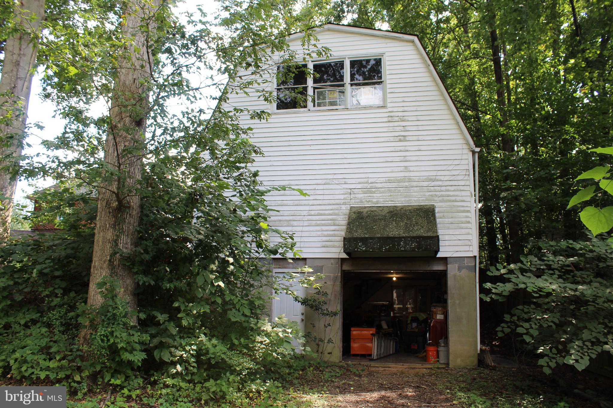 15090 Jonah Cove Place Woodbridge, VA 22193 - Photo 39 of 42 a front view of a house with garden