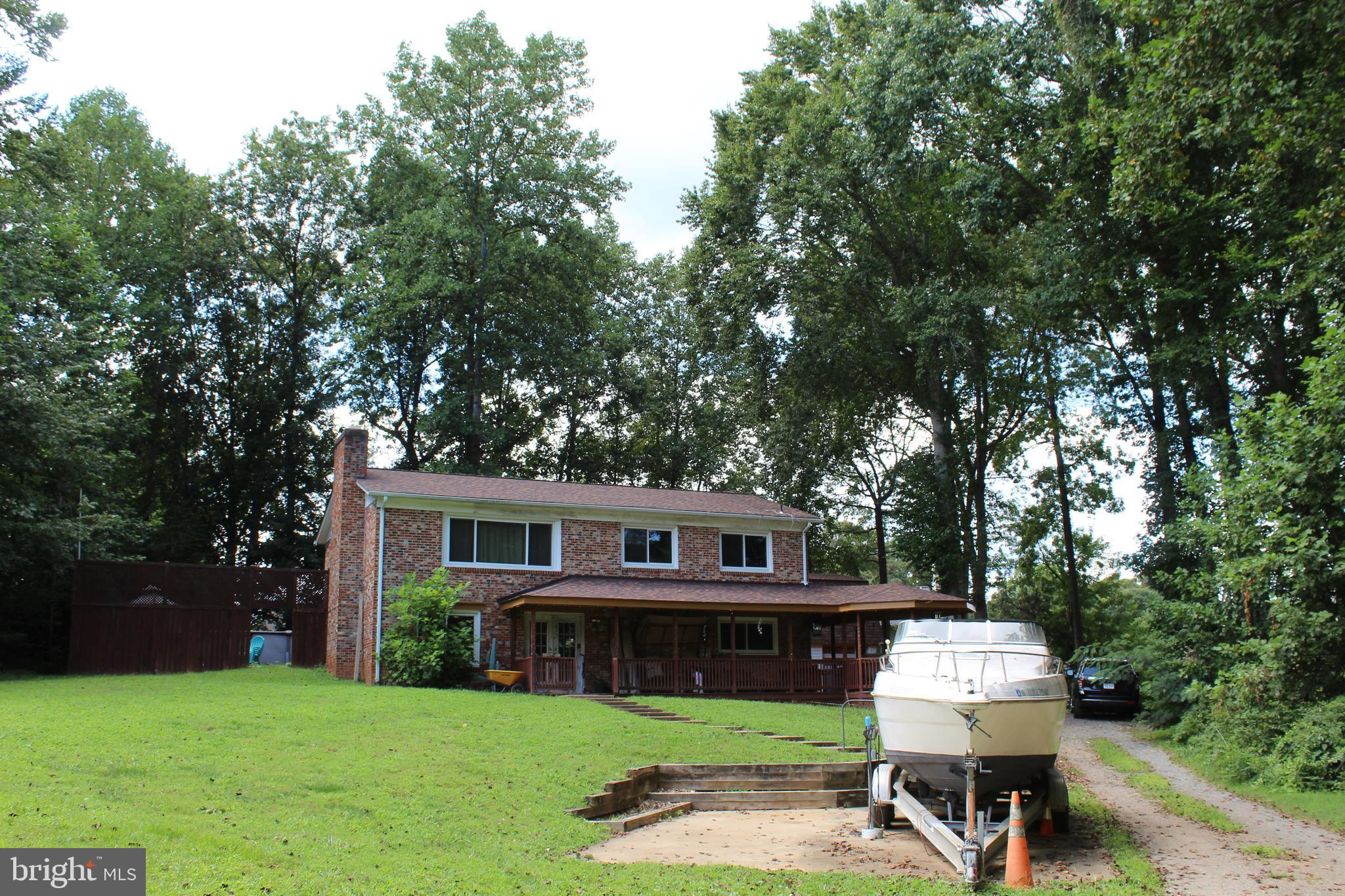 15090 Jonah Cove Place Woodbridge, VA 22193 - Photo 4 of 42 a view of house with a yard porch and furniture