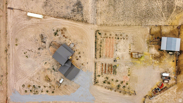 544 East 600 North, Unit 1 Joseph, UT 84739 - Photo 61 of 65 Aerial perspective showcasing a property with a main residence featuring a dark-toned roof, a separate outbuilding with a metal roof, and designated areas for cultivation