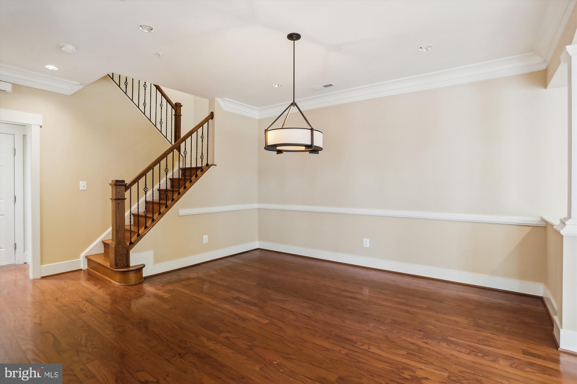 9539 Ament Street Silver Spring, MD 20910 - Photo 10 of 40 a view of a room with wooden floor and white walls