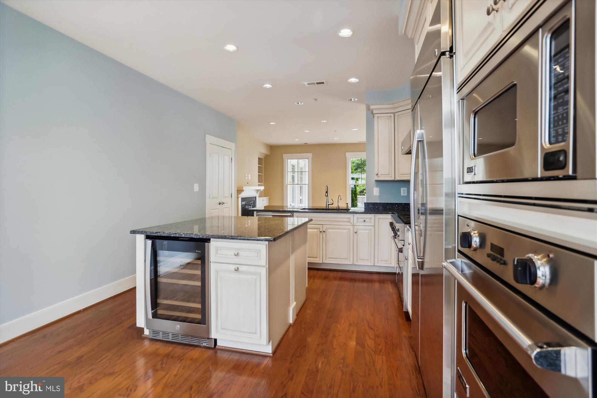 9539 Ament Street Silver Spring, MD 20910 - Photo 17 of 40 a kitchen with counter top space a sink and appliances