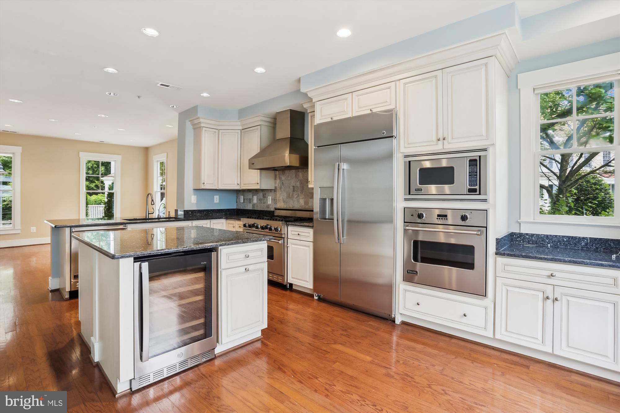 9539 Ament Street Silver Spring, MD 20910 - Photo 18 of 40 a kitchen with stainless steel appliances granite countertop a stove a refrigerator and a microwave