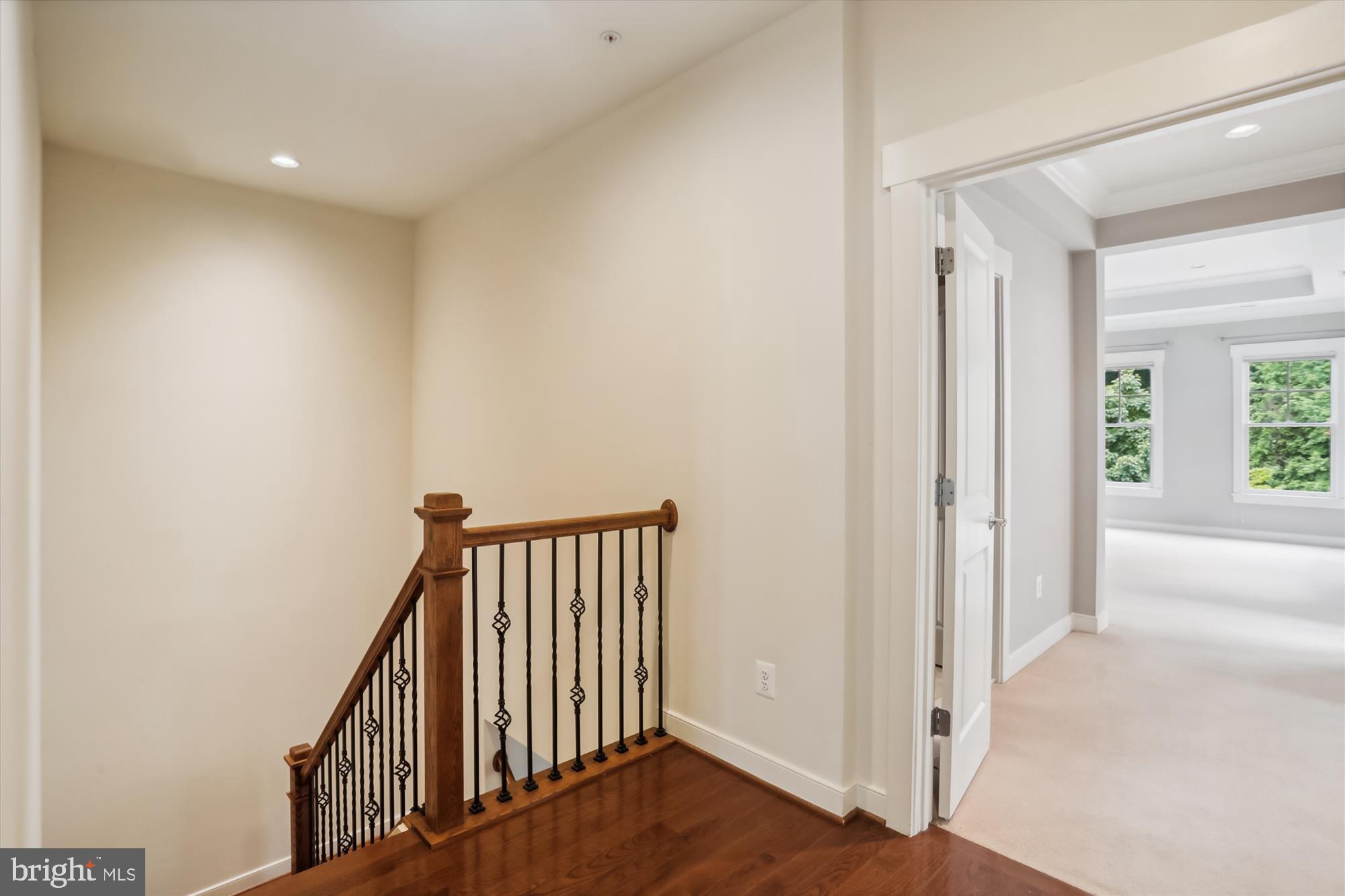 9539 Ament Street Silver Spring, MD 20910 - Photo 19 of 40 a view of a hallway with wooden floor and entryway