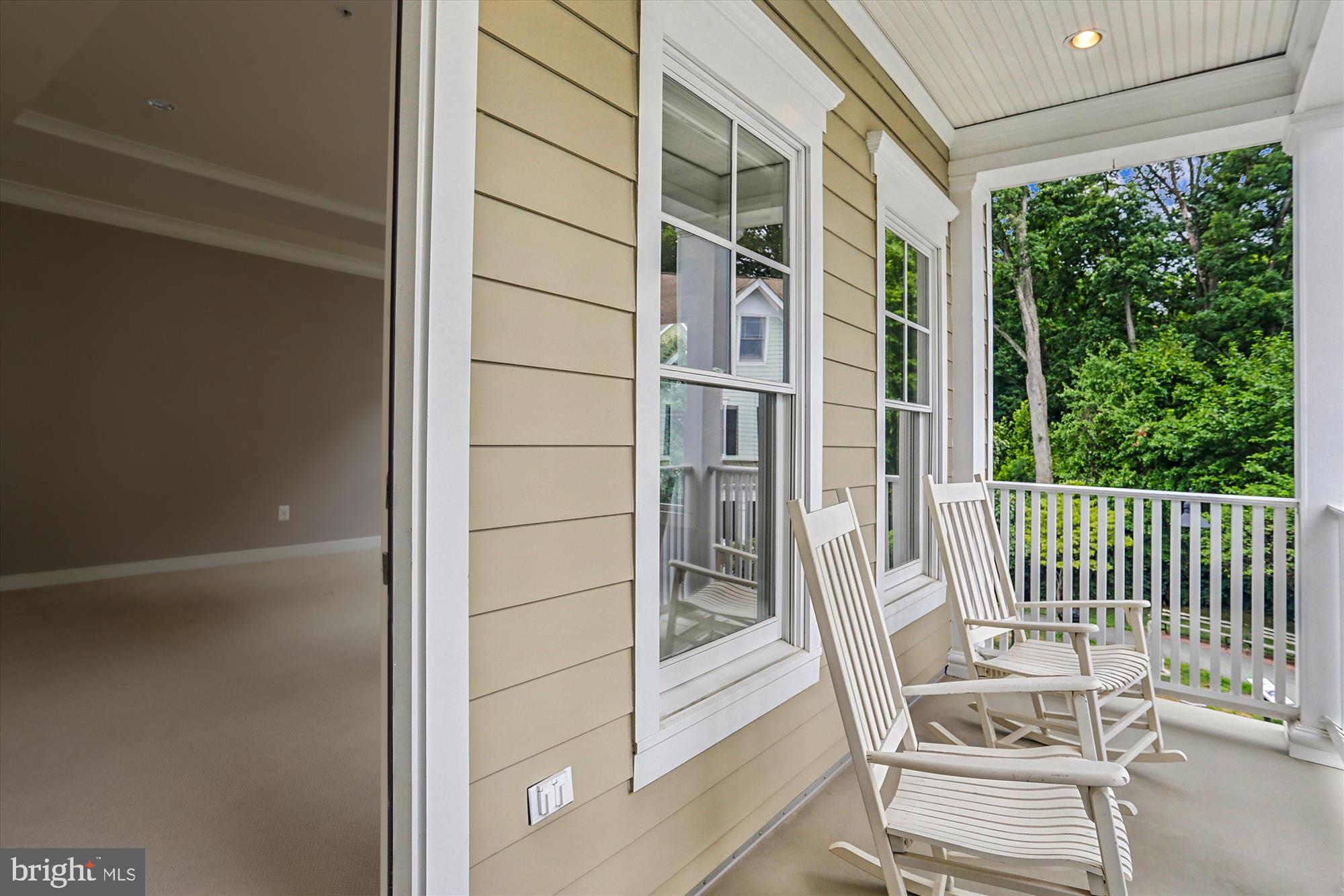 9539 Ament Street Silver Spring, MD 20910 - Photo 25 of 40 a balcony with table and chairs