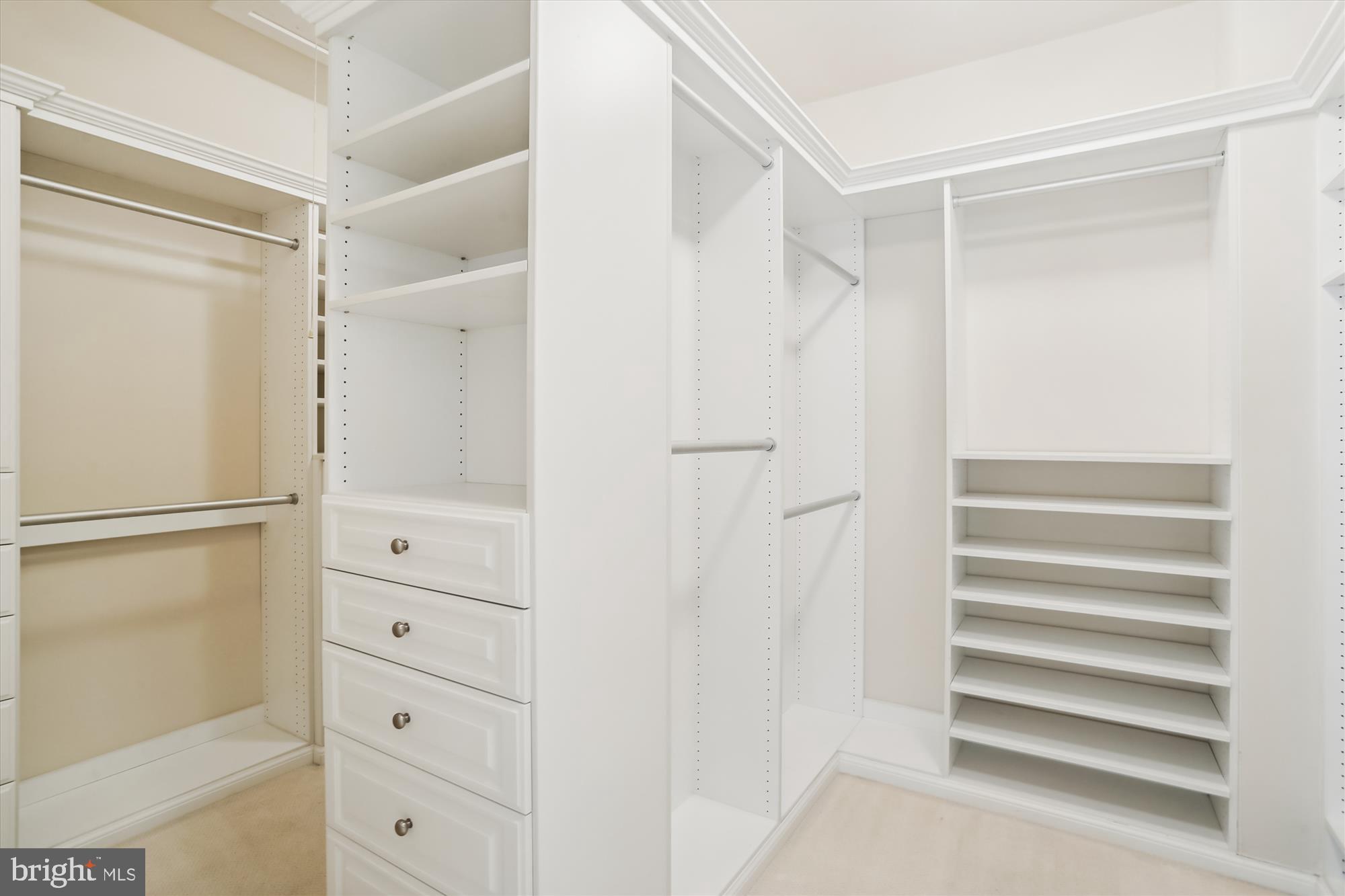 9539 Ament Street Silver Spring, MD 20910 - Photo 29 of 40 a view of walk in closet with empty racks