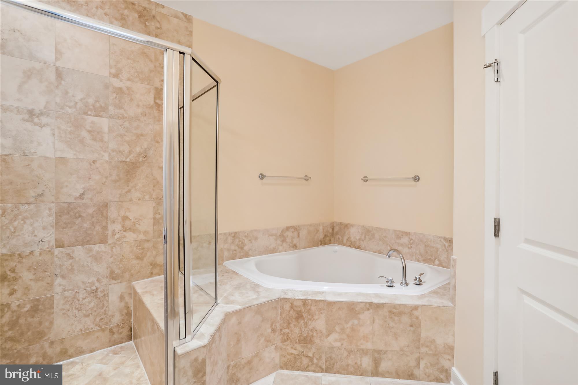 9539 Ament Street Silver Spring, MD 20910 - Photo 31 of 40 a white bath tub sitting next to a shower