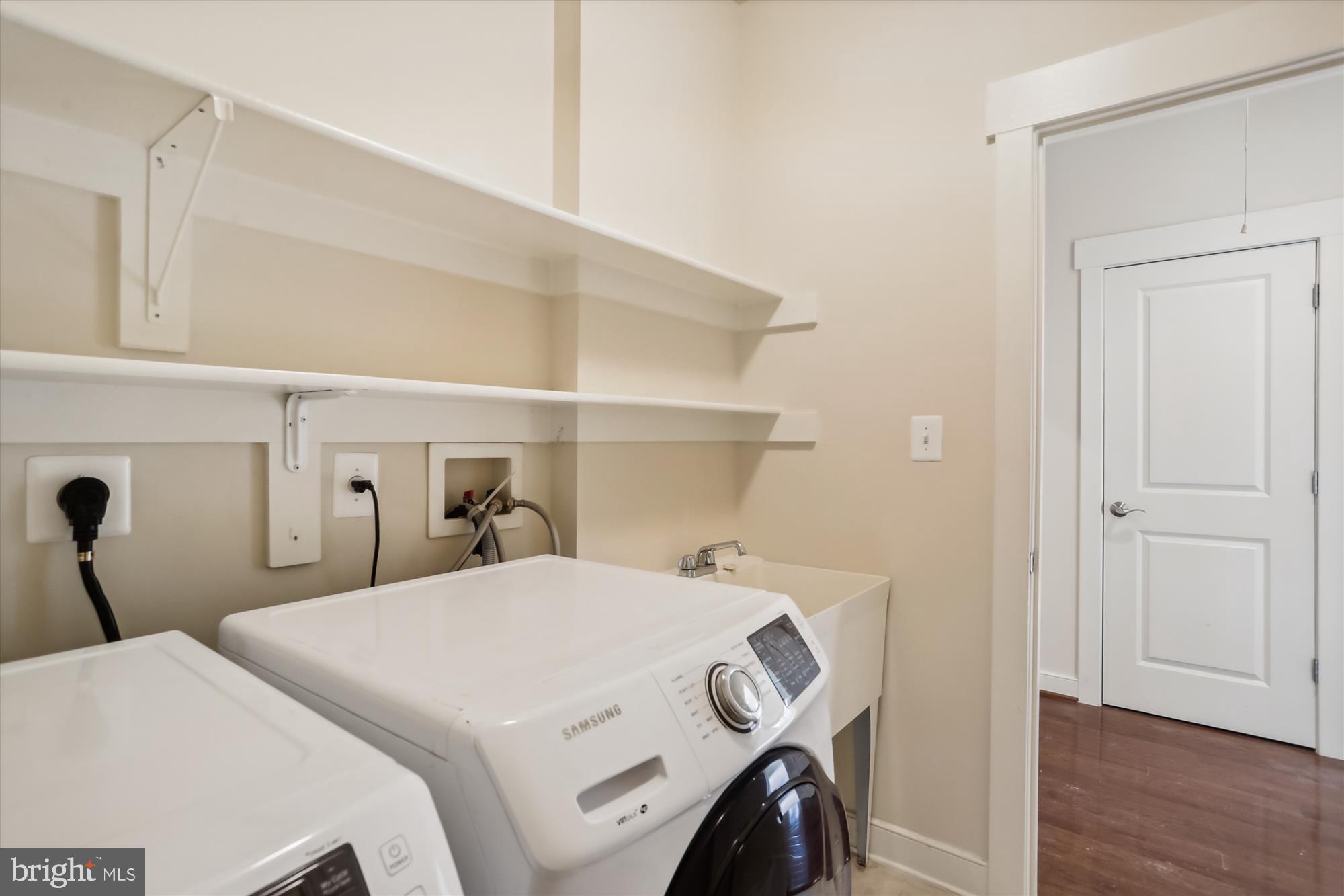 9539 Ament Street Silver Spring, MD 20910 - Photo 39 of 40 a bedroom with a bed and wooden floor
