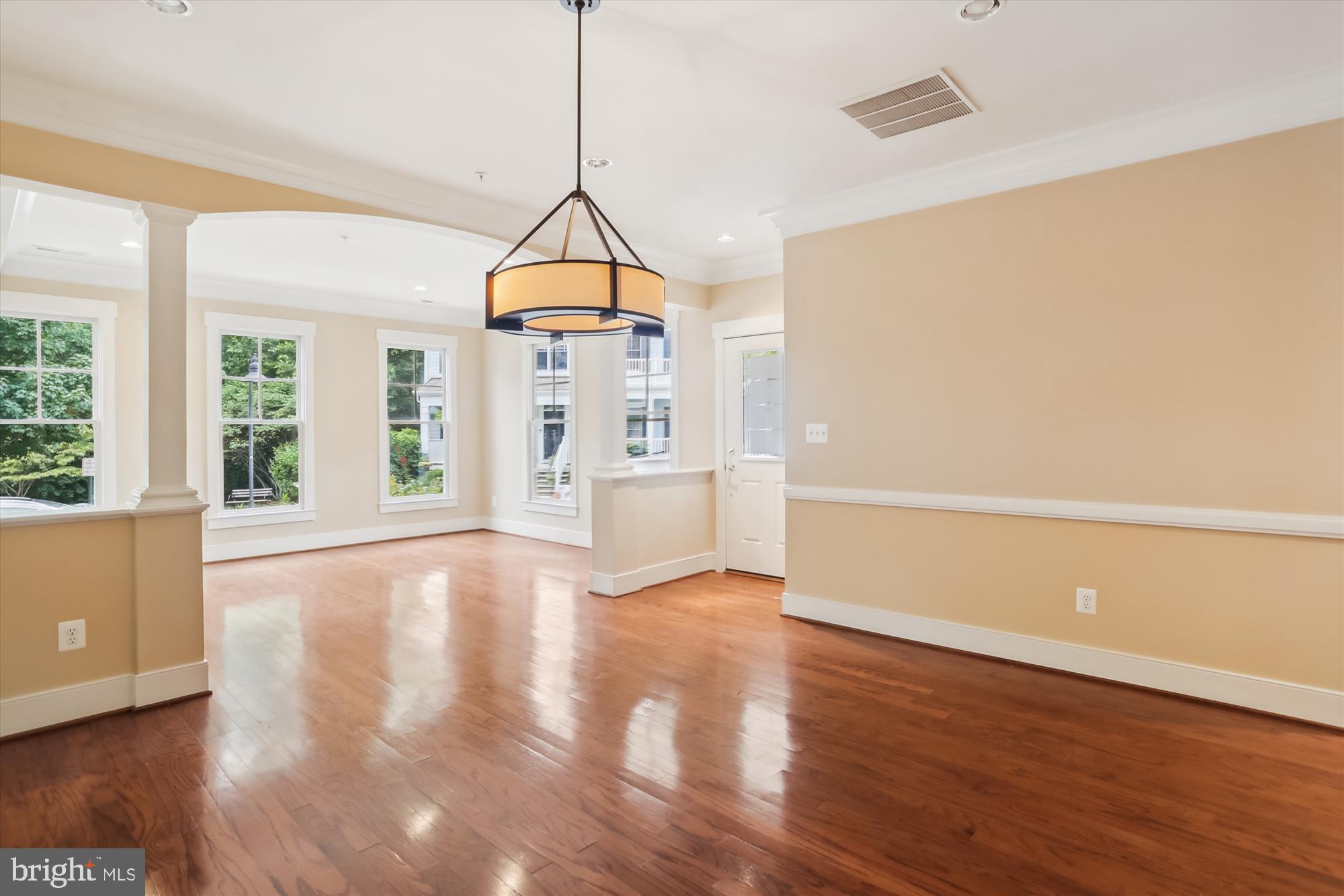 9539 Ament Street Silver Spring, MD 20910 - Photo 9 of 40 a view of empty room with wooden floor and windows