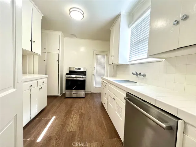 a view of a kitchen with electric appliances