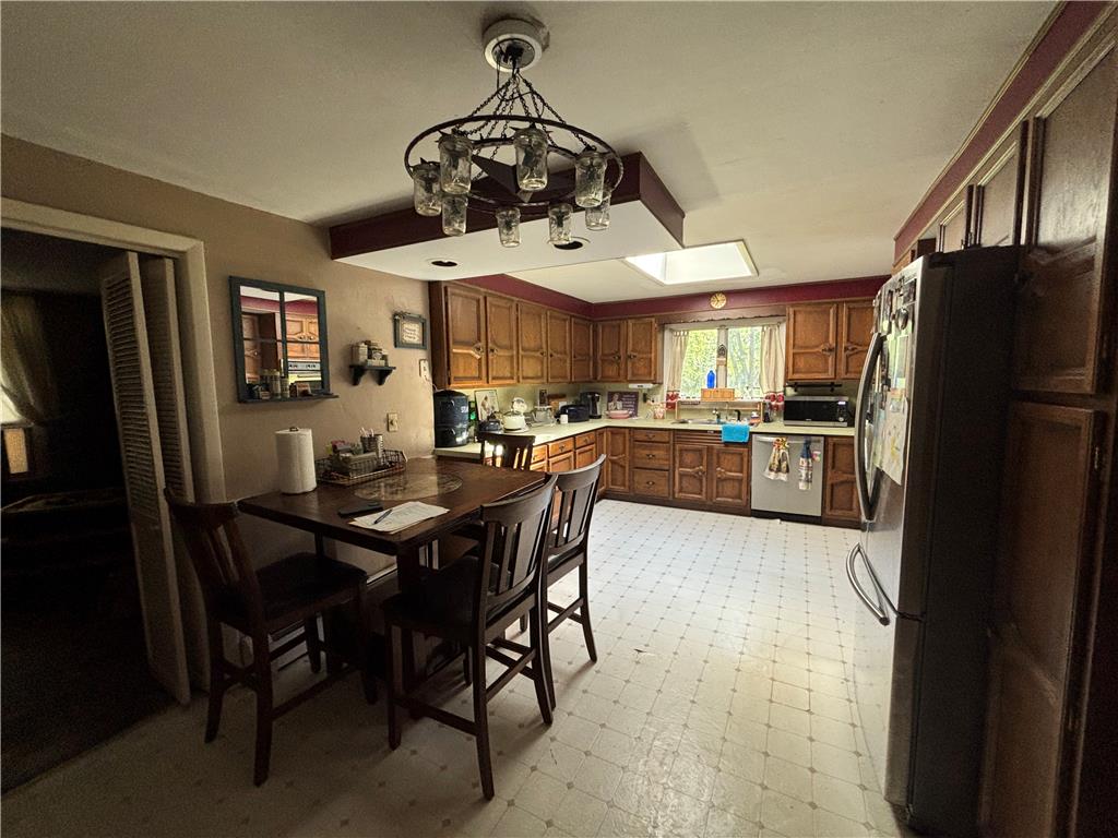 231 Laurel Road Lehighton, PA 18235 - Photo 13 of 36 Rich wood cabinetry and built-in fixtures define this classic kitchen layout.