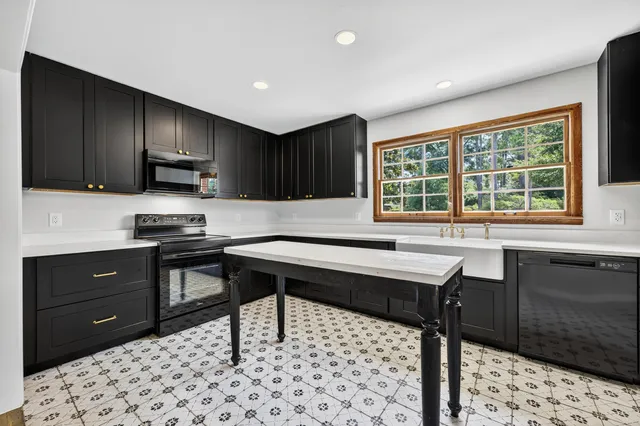 a view of a sink and a window