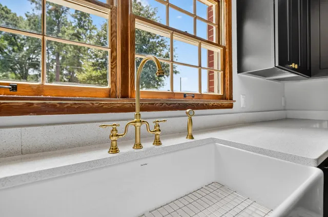 a kitchen with a refrigerator and a sink