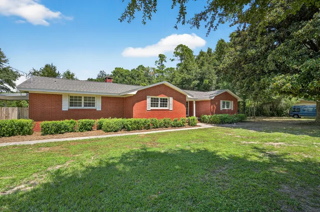 a house view with a garden space
