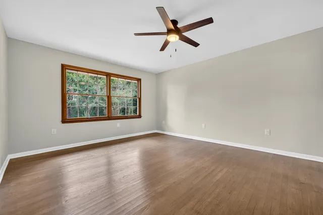 a bathroom with a sink a mirror and shower