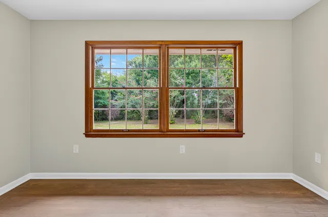 a view of empty room with floor to ceiling window