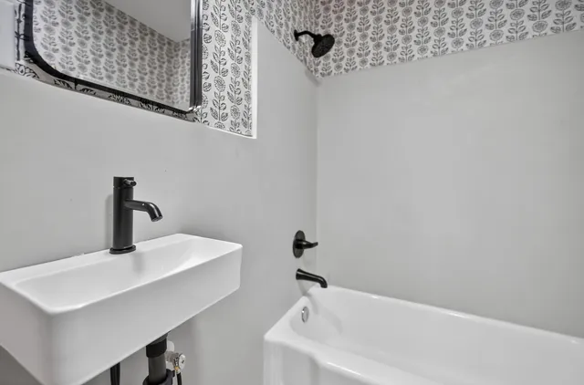 a view of room with window and ceiling fan