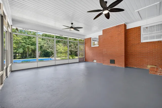 a view of a house with a yard and sitting area